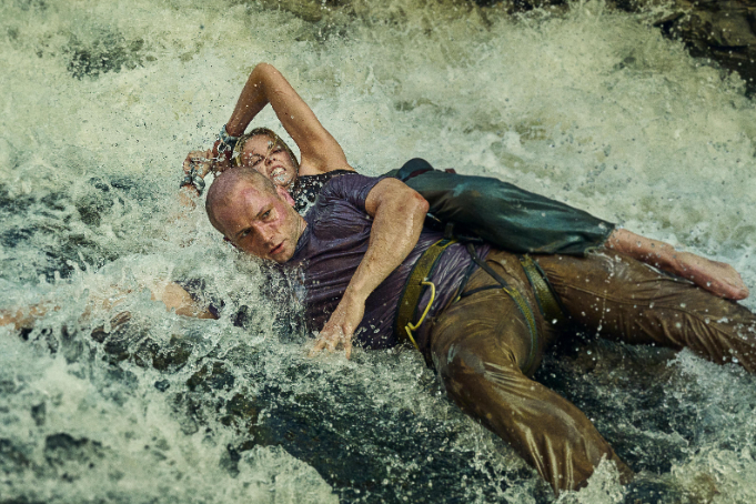 ‘APEX’ Trailer: Charlize Theron Fights For Survival In The Jungle With A Serial Killer Hot On Her Heels